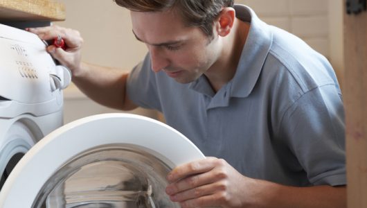 Engineer Mending Domestic Washing Machine